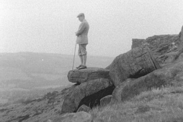 Black and white image of a man overlooking the Peak District.